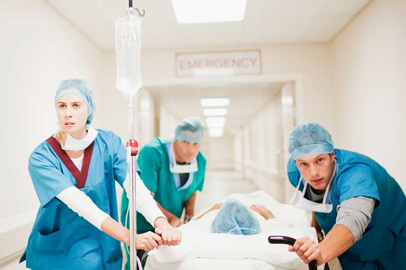 emergency nurses rushing patient in hospital