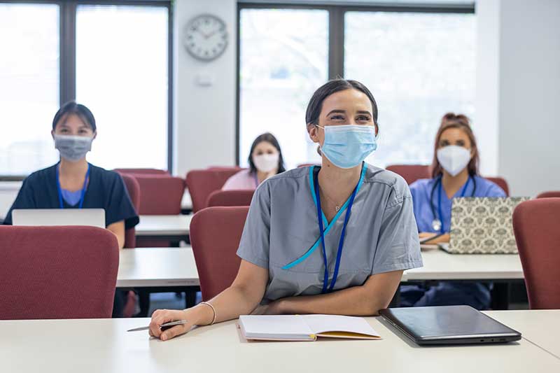 nurses wearing masks in classroom